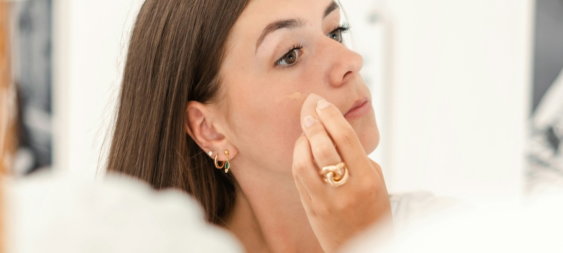 a-woman-with-her-hand-on-her-face.jpg a woman with her hand on her face